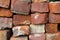 Stack of Old Red Clay Bricks and Mortar from A Salvaged Chimney