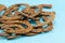 Stack of old retro horse shoes on blue