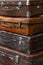 Stack of old vintage travel suitcases close up