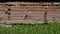 Stack old wooden boards planks in farm yard