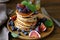 Stack pancakes with figs and blueberries