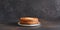 Stack of pancakes on the plate on a dark background. Thin pancakes. Good morning