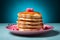 a stack of pancakes with raspberries on top