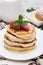 Stack of pancakes with raspberry and honey