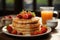 A stack of pancakes with strawberries on a plate and orange juice