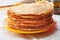 Stack of pancakes. Thin fragrant pancakes in a plate. Traditional rustic food