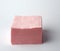 Stack of paper disposable pink folded square napkins