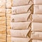 Stack of parcel wrapped in brown recycled paper