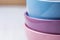 Stack of Pastel Multicolored Bowls on White Wood Table. Holiday Baking Cooking Concept. Christmas Easter. Scandinavian Kitchen