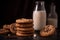 A stack of peanut butter cookies with a glass of milk