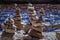 Stack of pebbles. Balancing on a river background.Rocks Stacked Close Up in a river bed