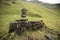 Stack of pebbles in a grass field