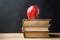 Stack Pile of Old Books Red Glossy Apple on Top. Learning Education Knowledge Concept. Blackboard Background. Classrom.