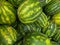 Stack pile of watermelons fruit stand fresh produce and vegetables arranged for background