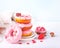 Stack of pink doughnuts on the plate. Valentine`s Day concept.