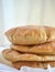 A stack of pita bread on a white background - fresh baked gluten-free pita bread