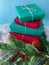 Stack of plain-colored Christmas presents on a snow