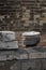 A stack of plates in the middle of a war-torn house