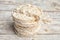 Stack of puffed rice cakes on white wooden table