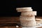 Stack of puffed rice cakes on wooden table against background. Space for text