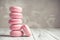 Stack of Raspberry pastel pink Macarons or Macaroons