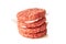 Stack of raw burger patties on white background