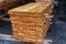 Stack of ready lumber boards on wood factory stockpile.