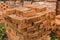 Stack of red brick for construction. Common quality building bricks stacked ready for use.