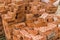 Stack of red brick for construction. Common quality building bricks stacked ready for use.