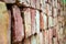 Stack of red bricks looks like brick wall. Selective focus on the pattern of bricks accumulated for the construction