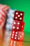 Stack of red casino dice against background
