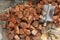 Stack of red clay Bricks and sand Shovel on filed construction site