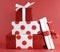 Stack of red and white polka dot theme festive gift box presents