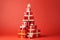 A stack of red wrapped Christmas presents tied with ribbon