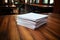 a stack of resumes on a wooden table