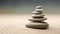 A stack of rocks sitting on top of a sandy beach Zen pyramid, stack of pebbles on sand with wind patterns.