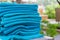 Stack roll of bath blue towels on table at swimming pool