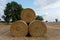 Stack of round bales of straw on a stubble field