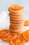 Stack of round shortbread and candied oranges