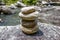 Stack of round smooth stones near mountain river