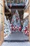 Stack of Santa Claus toys near decorated frosted Christmas Tree