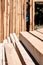 Stack of sawed wooden planks or timber at a construction site