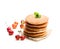 Stack of scotch pancakes with fresh wild apples isolated on whi
