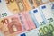 Stack of several euro banknotes money background.