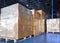 Stack of shipments boxes on wooden pallets. Interior of warehouse storage