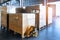 Stack of shipments boxes on wooden pallets. Interior of warehouse storage.