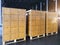 Stack of shipments boxes on wooden pallets. Interior of warehouse storage.