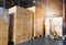 Stack of shipments boxes on wooden pallets. Interior of warehouse storage.