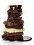 Stack slices porous black, white chocolate sprinkled with hot isolated.