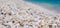 Stack of small white stones on tropical pebbles